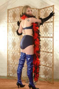 Carlie in blue bra and matching vintage style pantie girdle, and PVC beddyboots