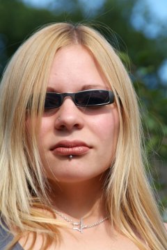 Becky outdoors in sunglasses