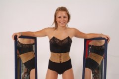 Sara with mirrors in black strapless bra, girdle and suede corset-belt
