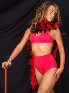 Shelley models red Chinese bra and pocket girdle, with feather boa