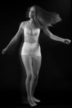 Josie Lauren in vintage white bra and firm "Little X" pantie girdle, strobe experiment