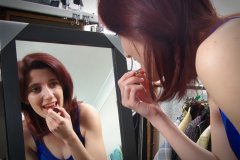 Dawsie making-up in blue kickboxing outfit