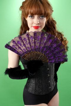 Kirsten-Ria black corset and girdle holding fan