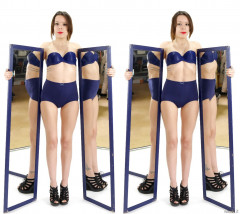 2015-03-21 LTidy, blue bra and girdle, pulling in her tummy.