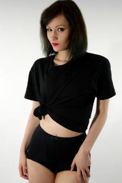 Olive Cartley t-shirt and black conrol briefs worn as hotpants