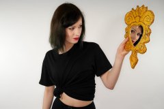 Olive Cartley t-shirt and black conrol briefs worn as hotpants
