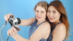 2015-12-11 Chelskii and Laura larking about in one-piece M&S crocskin swimsuits