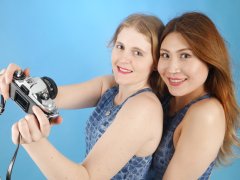 2015-12-11 Chelskii and Laura larking about in one-piece M&S crocskin swimsuits