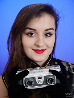 2016-12-04 Nannina in full-length cheongsam holding Wray Stereographic camera
