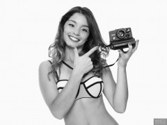 2017-09-03 Kris in multicoloured neoprene bikini with Polaroid Land Camera