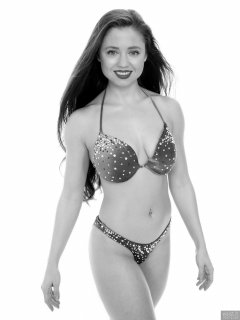 Charlene Joy posing in her fitness competition bikini