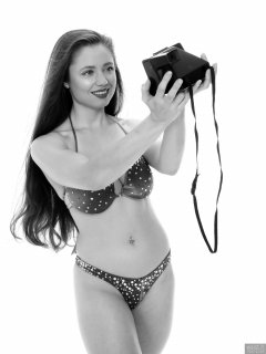 Charlene Joy posing in her fitness competition bikini