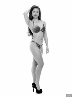 Charlene Joy posing in her fitness competition bikini