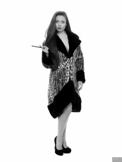 Charlene Joy in vintage fur coat, worn over her competition bikini