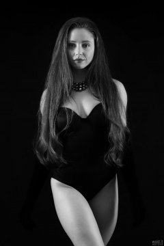 Charlene Joy in tight black Miraclesuit bodyshaper