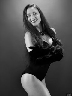 Charlene Joy in tight black Miraclesuit bodyshaper