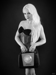 2018-03-17 Dayna Nirvana tightly-laced purple underbust corset over black bra and back control briefs worn as hot-pants with vintage Ferguson portable radio