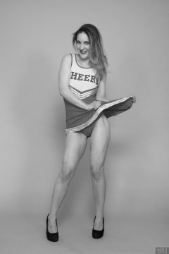 2018-04-07 Annie91 in her cheerleader costume, worn over red one-piece swimsuit