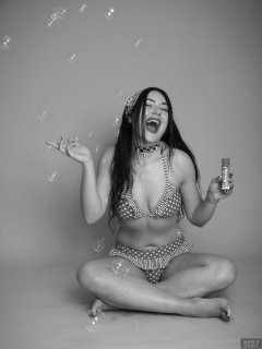 2018-06-15 Tatjana Bastet blowing bubbles in red and white polka-dot bikini