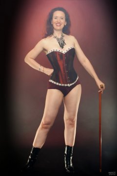 2018-07-07 Chiara in her own tightly-laced, long-line burgundy over-bust corset, worn over firm-control burgundy pantie-girdle, worn as hotpants