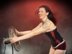 2018-07-07 Chiara in her own tightly-laced, long-line burgundy over-bust corset, worn over firm-control burgundy pantie-girdle, worn as hotpants