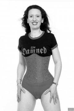 2018-07-07 Chiara in a tightly-laced underbust corset, worn over her own "Damned" t-shirt, worn over red Chinese bra and pocket girdle