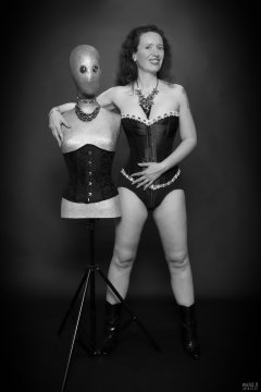 2018-07-07 Chiara in her own tightly-laced, long-line burgundy over-bust corset, worn over firm-control burgundy pantie-girdle, worn as hotpants