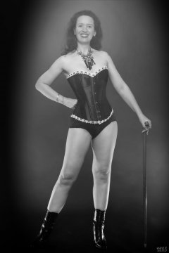 2018-07-07 Chiara in her own tightly-laced, long-line burgundy over-bust corset, worn over firm-control burgundy pantie-girdle, worn as hotpants