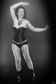 2018-07-07 Chiara in her own tightly-laced, long-line burgundy over-bust corset, worn over firm-control burgundy pantie-girdle, worn as hotpants
