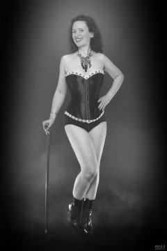 2018-07-07 Chiara in her own tightly-laced, long-line burgundy over-bust corset, worn over firm-control burgundy pantie-girdle, worn as hotpants