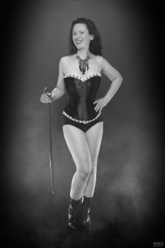 2018-07-07 Chiara in her own tightly-laced, long-line burgundy over-bust corset, worn over firm-control burgundy pantie-girdle, worn as hotpants