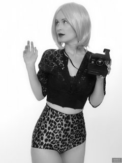 2018-09-16 Saffine with 1970's vintage Polaroid Land camera, in black strapless bra top, black bolero and animal print pantie girdle worn as hotpants