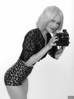 2018-09-16 Saffine with 1970's vintage Polaroid Land camera, in black strapless bra top, black bolero and animal print pantie girdle worn as hotpants