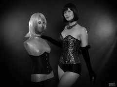2018-09-16 Saffine posing with corsetted silver droid, in her own silver and black tightly-laced corset, black boob tube and black Style 210 pantie girdle worn as hotpants