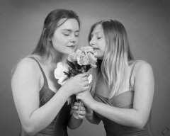 2019-05-04 CloEliza and Fabiene smelling the flowers in purple vintage tummy-control one-piece swimsuits