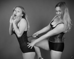 2019-05-04 Corset fun: Fabiene being laced rather tightly by her friend CloEliza