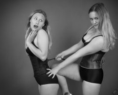 2019-05-04 Fun with serious corsetry: Fabiene and CloEliza in tightly-laced underbust corset, worn over black bras and tight black vintage-style pantie girdles, worn as hotpants