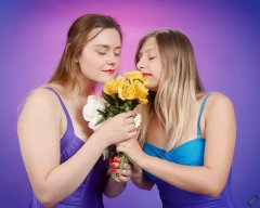 2019-05-04 CloEliza and Fabiene smelling the flowers in purple vintage tummy-control one-piece swimsuits