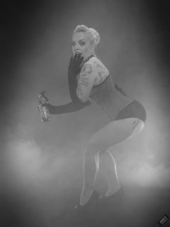 2019-05-25 KL Modelling - in tightly-laced red vollers overbust corset, worn over tight black Miraclesuit bodyshaper