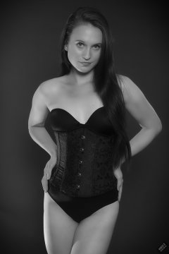 2019-09-21 Kristine Gold - in tightly-laced black underbust corset worn over black Miraclesuit strapless one-piece bodyshaper