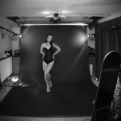 2019-09-21 Kristine Gold - in tightly-laced black underbust corset worn over black Miraclesuit strapless one-piece bodyshaper