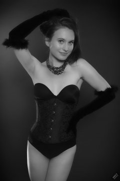 2019-09-21 Kristine Gold - in tightly-laced black underbust corset worn over black Miraclesuit strapless one-piece bodyshaper