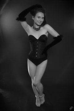 2019-09-21 Kristine Gold - in tightly-laced black underbust corset worn over black Miraclesuit strapless one-piece bodyshaper