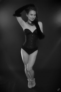 2019-09-21 Kristine Gold - in tightly-laced black underbust corset worn over black Miraclesuit strapless one-piece bodyshaper