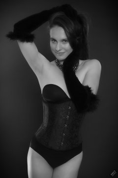 2019-09-21 Kristine Gold - in tightly-laced black underbust corset worn over black Miraclesuit strapless one-piece bodyshaper