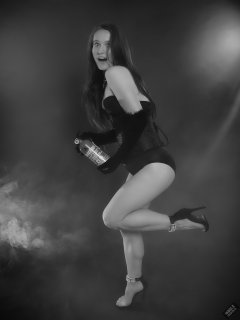 2019-09-21 Kristine Gold - in tightly-laced black underbust corset worn over black Miraclesuit strapless one-piece bodyshaper