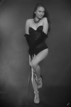 2019-09-21 Kristine Gold - in tightly-laced black underbust corset worn over black Miraclesuit strapless one-piece bodyshaper