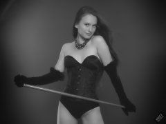 2019-09-21 Kristine Gold - in tightly-laced black underbust corset worn over black Miraclesuit strapless one-piece bodyshaper