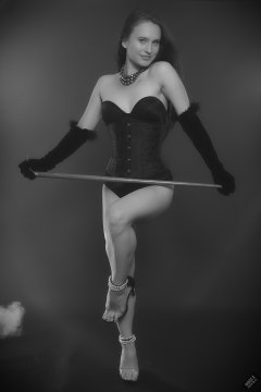 2019-09-21 Kristine Gold - in tightly-laced black underbust corset worn over black Miraclesuit strapless one-piece bodyshaper