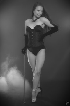 2019-09-21 Kristine Gold - in tightly-laced black underbust corset worn over black Miraclesuit strapless one-piece bodyshaper